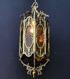 an ornate light fixture hanging from the ceiling