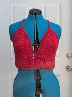 Large handmade crochet top with lace-up back in red. 100% cotton. Measurements: Bottom Band  Length - 28 " Bottom Band Height - 3" Cup Height (excluding bottom band) - 8" Cup Width (each) - 8.5" For best care, hand wash or machine wash with cold water in delicates bag on a gentle cycle and lay flat to dry. Made from Lilly pattern by Kelsie at PassioKnit Goods, passioknitgoods.com. Festival Crochet V-neck Crop Top, Red Cotton V-neck Crop Top, Fitted V-neck Crop Top With Crochet Trim, Fitted Cotton Crochet Top V-neck, Cotton Crochet V-neck Top, Festival Crochet Trim Triangle Top, Fitted Cotton Crochet Top With Crochet Lace, Fitted Cotton Crochet Top With Lace, Triangle Top With Crochet Trim For Festivals