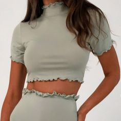 Missguided Coord Ss Crop Top Lettuce Hem ~Color Sage ~Size 8 ~Sage Jersey Short Sleeve Crop Top With A High Neck And Lettuce Hem Finish ~Regular Fit Crop - Sits At The Waist ~96% Polyester 4% Elastane *Feel Free To Request Pictures Of Actual Item *Item Is Sealed And Brand New Fitted Short Sleeve Solid Color Crop Top, Fitted Green Solid Color Crop Top, Spring Solid Color Short Sleeve Crop Top, Spring Short Sleeve Solid Color Crop Top, Fitted Solid Color Crop Top For Spring, Stretch Crop Top With Ruffles And Short Sleeves, Stretch Ruffle Crop Top With Short Sleeves, Fitted Green Crop Top With Ruffles, Green Solid Color Crop Top For Spring