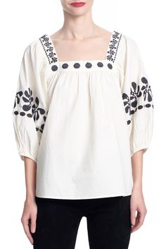 The Winnie top is a pull over style with balloon sleeves. The square neckline has our cross-stitch embroidery that is repeated along the sleeve. made from organic cotton. Content: 100% Organic cotton Color: Black or Ivory Fits: relaxed fit. Take your normal size or size down for less volume Sizes: XS-L What we Love: Pretty shape Made in India Patricija is 5'10" size 2 and is wearing a size S xs s m l length 25.5 26 26.5 27 sweep 47 49 51 54 bust 38 40 42 45 Fall Tops With Gathered Sleeves And Square Neck, Square Neck Tops With Gathered Sleeves For Fall, Spring Cotton Puff Sleeve Top With Square Neck, Cotton Peasant Top With Puff Gathered Sleeves, Spring Cotton Peasant Top With Square Neck, Cotton Peasant Top With Puff Sleeves, Casual Floral Embroidered Square Neck Top, Cotton Peasant Top With Gathered Balloon Sleeves, Casual Floral Embroidery Square Neck Top