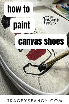 paint brush painting a school logo on white canvas shoes - Canvas Shoe Painting, Diy Fabric Shoes, Paint Canvas Shoes, How To Paint Canvas, Christmas Shoes Diy, Canvas Shoes Diy, Upcycle Shoes, Artsy Shoes, Cheerleading Shoes