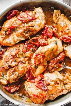 chicken with tomatoes and sauce in a skillet