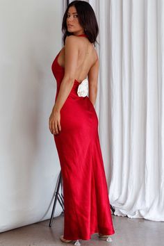 Red, satin dress Bust lined Halterneck style Boning in bodice Satin rose feature in back Zipper in side Can we take a moment for this dress? Our Of Your Dreams dress is sure to make jaws drop! We are obsessed with its satin rose embellishment in the back and classic halter silhouette. Perfect for any occasion where you really need to leave a lasting impression. Team it with clear heels and a satin clutch and watch heads turn. MODEL INFO Model is wearing size XS Height: 5'2" Bust: 33.5" Waist: 25 Red Dress Jewelry Ideas, Red Satin Dress, Satin Clutch, Yellow Bridesmaids, Red Bridesmaids, Satin Roses, Blue Bridesmaids, Clear Heels, Date Night Dresses