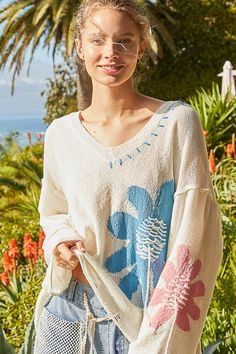 The Distressed Flower V-Neck Dropped Shoulder Knit Top is a stylish and edgy piece that adds a touch of flair to any outfit. With its unique flower detailing, v-neckline, and dropped shoulder design, this knit top exudes a cool and casual vibe. Perfect for creating a fashionable and laid-back look, this top is versatil Hoodie Top, Stretchy Material