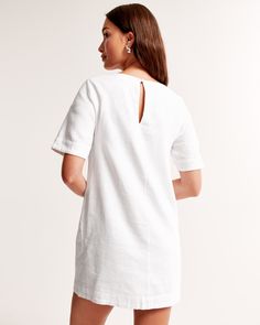 Easy-fitting short-sleeve shirt dress in our soft linen-blend fabric, featuring crew neckline and back keyhole closure. Spring Crew Neck Short Sleeve Dress, Casual T-shirt Dress For Summer Workwear, White Linen Summer Dress For Work, White Linen Dress For Summer Workwear, White Relaxed Fit T-shirt Dress For Spring, White Linen Short Sleeve Dress For Work, Casual Short Sleeve Linen Dress For Brunch, Chic Short Sleeve Linen Dress For Brunch, White Relaxed Fit Crew Neck Dress