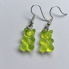 green gummy bears dangling from silver earwires