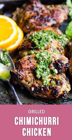 grilled chicken with cilantro and parsley on the side, next to orange slices