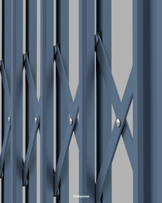 an abstract image of metal bars with rivets and screws on them, as if they were painted blue