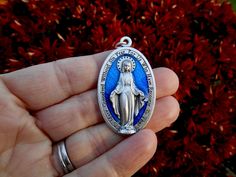 XL Blue Enamel Miraculous Medal Beautiful detail! Miraculous Medal Made in Italy. Metal Alloy, High-quality medals. Size: 1 3/4 Inches!! (44.45mm) Need a Chain: Add this listing to your cart. https://www.etsy.com/listing/866694780/sterling-silver-box-chain-925-solid?ref=shop_home_active_1 Rugged Rosary, Medal Jewelry, Miraculous Medal Necklace, Saint Medals, 1970s Tv Shows, Images Of Mary, Special Prayers, Saints Medals, Miraculous Medal