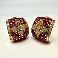 18K Gold Diamond and Ruby Square Clip-on Earrings (includes appraisal, Value: $12,000) Designer = Jewelry Material = 18K Gold Gemstone = Diamond/Ruby Condition = Excellent Class = Premier Location: Wilmette Item Number: 3243-116 Item ID: 270171 Category: Earrings Luxury Multi-stone Diamond Earrings For Formal Occasions, Luxury Multi-stone Earrings For Formal Occasions, Luxury Multi-stone Diamond Earrings For Anniversary, Luxury Multi-stone Diamond Earrings, Luxury Multi-stone Earrings For Anniversary, Luxury Clip-on Diamond Earrings For Formal Occasions, Luxury Clip-on Diamond Earrings For Formal Events, Luxury Formal Clip-on Diamond Earrings, Luxury Ruby Gemstone Earrings