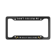 a black license plate frame that says, don't follow me i'm driving