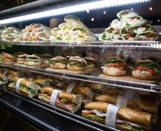 a display case filled with lots of sandwiches