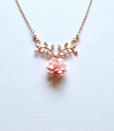 "2018 COLLECTION, a nature inspired necklace featuring blush Dahlia flower dangled on metal branch. If you prefer different color, please drop a note. Detail : - Hand sculpted Dahlia made of Polymer Clay . Size approx: 16-17mm. - Rose Gold plated over brass branch. - Cream Swarovski Pearls - Gold Plated over brass chain as pictured, silver plated, rose gold available. - Entire length 16\" + 2 extenders. - Handmade in The USA - Made to order in 3-4 business days. If you need earlier shipping date Rose Gold Nature-inspired Flower Pendant Necklace, Rose Gold Flower Pendant Necklace Nature-inspired, Rose Gold Flower Pendant Necklace, Nature-inspired, Delicate Pink Pendant Flower Necklace, Delicate Pink Flower Pendant Necklace, Delicate Rose Gold Flower Necklaces, Delicate Rose Gold Pendant Flower Necklace, Nature-inspired Rose Gold Pendant Necklace, Feminine Rose Gold Flower Pendant Necklace