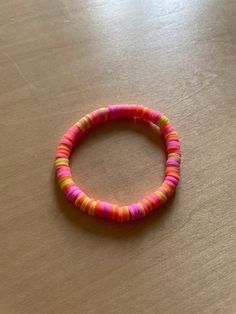 a bracelet with neon colors! ⚡️ Trendy Pink Friendship Bracelets For Festival, Trendy Neon Jewelry, Colorful Vibrant Bracelets For Festivals, Vibrant Colorful Bracelets For Festivals, Handmade Neon Jewelry For The Beach, Vibrant Colorful Festival Bracelets, Vibrant Adjustable Bracelets, Trendy Neon Bracelets As Gift, Trendy Neon Bracelets For Gifts