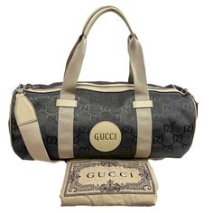 Gucci - New W/O Tags - Off The Grid Duffle Monogram - Graphite - Handbag Description This Duffel Bag Is Crafted Of Gucci Gg Monogram Nylon. The Bag Features Black Leather Top Handles, Leather Trim, And Silver Hardware. The Top Zipper Opens To A Spacious Grey Nylon Interior With A Pocket. Measurements Width: 18.50 In / 46.99 Cm Height: 10.50 In / 26.67 Cm Depth: 10 In / 25.4 Cm Strap Drop: 23 In / 58.42 Cm Handle Drop: 8 In / 20.32 Cm Details Made In: Italy Color: Graphite Accessories: Dust Bag, Gucci Duffel Bag Travel, Duffle Bags Gucci, Gucci Marmont Bag, Gucci Mini, Black Leather Top, Gucci Crossbody, Gg Monogram, Canvas Crossbody Bag, Brown Handbag