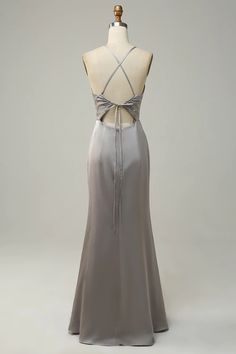 a dress on a mannequin dummy with the back cut out to show it's neckline