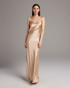 Named by Vogue as a must-have, this easy to wear luxury charmeuse slip dress is the perfect day to night staple. Featuring a bias cut and the finest silk quality, it shapes flatteringly to every type of body. Bias cut silk charmeuse slip elegantly drapes on the body. 100% Silk Charmeuse Made in New York City Model is wearing a size S and is 5'10" Product Care: Dry Clean Only Suri Alpaca, City Model, Convertible Dress, Midi Slip Dress, Long Gloves, The Perfect Day, Silk Slip Dress, Silk Tank, Silk Slip