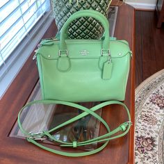 This Bag Is A Beautiful Spring Green Color And Has Absolutely Never Been Used!! 100% Authentic. The Detachable Handle Has A Maximum 26” Drop & Could Also Be Made Shorter. Beautiful Silver Hardware. Can Be Used All Spring & Summer. A Sassy Little Bag For Evening Outings Using The Satchel Handles Or A Cute Little Crossbody When You Are On The Go. The Original Price Is $250. All Offers Will Be Considered. Green Rectangular Satchel With Branded Hardware, Rectangular Green Satchel With Branded Hardware, Classic Green Satchel With Branded Hardware, Green Satchel With Branded Hardware For Shopping, Green Tote Satchel With Branded Hardware, Green Satchel Bag With Branded Hardware, Green Rectangular Coach Bags, Coach Green Bags With Detachable Strap, Green Coach Bag With Detachable Strap