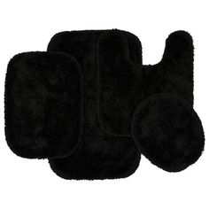 three black bath mats on top of each other in front of a white background,