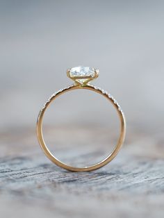 an engagement ring with a diamond on top