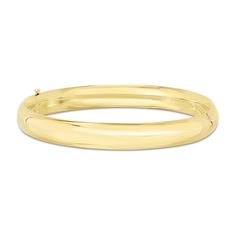 Complement any attire with the simple and sleek design of this polished bangle bracelet in 14K gold. Fashioned in 14K gold This classic bangle shines with a polished 8.0mm tube. This bracelet measures 7.0 inches in circumference and secures with a hinged clasp. Classic 14k Gold Bangle With Shiny Finish, Yellow Gold Polished Bangle Bracelet, Tarnish Resistant 14k Yellow Gold Bangle, Affordable Adjustable Yellow Bangle, Yellow Gold Tarnish-resistant Bangle Bracelet, Adjustable Yellow Bangle, Classic Bangles, Bangle Bracelet, Sleek Design