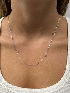 "➣ High quality Solid 14K White Gold 1.5mm Adjustable Paperclip Chain with Lobster Lock, 22\" Long, Set Your Own Length, Real Gold Necklace, Women ➣ MATERIAL: 14K White Gold  ➣ Closure: Lobster claw   ➣ Solid / Hollow: Solid  ➣ Weight: 2.60g ◈ Please note that weights are approximate. ➣ If you need a specific length, please message us. ➣ SHIPPING: ◈ We always offer domestic FREE SHIPPING via USPS first class (3-5 business days)  ◈ We ship internationally, shipping costs are shown at checkout.     Please be aware that the buyer is responsible for any international customs & duties. ◈ Orders shipped from NYC usually within 24-48 hours from receiving payment.   ◈ All orders are packaged in a gift box at no additional cost. ➣ Return / Exchange policy: ◈ Your satisfaction is important to us! Se White Gold Jewelry With Rectangular Links As A Gift, White Gold Jewelry With Rectangular Links For Gifts, Sterling Silver Figaro Chain Jewelry, Sterling Silver Delicate Paperclip Chain Necklace, Sterling Silver Delicate Chain Necklace Paperclip Shape, Sterling Silver Paperclip Cable Chain Jewelry, Sterling Silver Jewelry With Figaro Chain, White Gold Jewelry With Adjustable Chain And Rectangular Links, White Gold Jewelry With Rectangular Links And Adjustable Chain