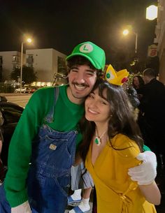 a man and woman dressed up in mario bros costumes