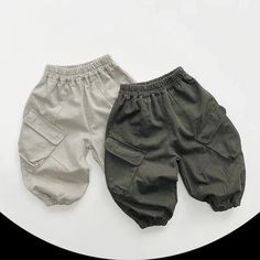 Upgrade your little one's wardrobe with our Children's Solid Cargo Pants. Made from soft and breathable cotton, these pants provide ultimate comfort for your child. The loose fit allows for easy movement, while the elastic waist ensures a secure and adjustable fit. With their trendy harem style and convenient pockets, these pants are both fashionable and functional. Suitable for both boys and girls, these solid-colored pants are a versatile addition to any outfit. Perfect for spring and autumn, Casual Cotton Sweatpants For Playtime, Summer Cotton Joggers With Pockets, Cotton Sweatpants With Elastic Waistband For Playtime, Cotton Sweatpants For Spring Playwear, Spring Cotton Cargo Pants With Elastic Cuffs, Cotton Relaxed Fit Bottoms For Playtime, Gray Cotton Bottoms With Elastic Cuffs, Bottoms With Elastic Waistband For Playtime, Solid Cotton Playwear Bottoms