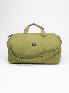 a green duffel bag on a white background