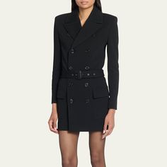 Saint Laurent blazer mini dress with an adjustable belted waist  Double-breasted front Notched collar  Two-row button front  Long sleeves Front patch pockets  Hem falls above the knee  Bodycon silhouette  Wool/nylon/polyamide Made in Italy Luxury Fitted Mini Dress With Button Closure, Luxury Belted Business Blazer, Fitted Blazer Dress For Business In Fall, Black Blazer Dress For Career In Fall, Fitted Belted Evening Outerwear, Fitted Belted Outerwear For Evening, Designer Belted Blazer For Work, Black Lapel Collar Blazer Dress For Career, Luxury Belted Blazer For Work