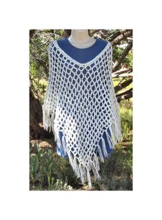 Hand crocheted Soft White boho style poncho. Open Mesh weave for a light poncho perfect for cool summer nights. Created using Red Heart Super Saver acrylic yarn in the "Soft White" colorway. One size fits most (up to 2X). Bohemian Handwoven Shawl Poncho, Bohemian Handwoven One-size Cape, Bohemian One-size Handwoven Cape, Bohemian Handwoven Poncho One Size, Casual Festival Poncho With Fringe, Bohemian Handwoven Poncho For Festival, Bohemian Woven Poncho For Festivals, Bohemian Woven Poncho One Size, Bohemian One-size Woven Poncho