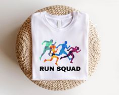 Run Squad T-shirt, Runner Cute Shirt, Running Team Tee, Marathon Training Shirt, Group Run Gift, Jogging Team Tee, Exercise Motivation Shirt 🕕Production Time 1 business day🕕   ---𝗛𝗢𝗪 𝗧𝗢 𝗢𝗥𝗗𝗘𝗥  ⬅️ * Please review all the information provided in the description and listing images. * Select the shirt type and size using the drop-down menu. * Select the color of the shirt using the following drop-down menu.  *Your shirts will be ready to ship in 1-2 Business Days.  *Please message me if you have a rush order and need your shirts quickly. ---MATERIAL-- * The unisex t-shirts are true-to-size shirts. Shirts are a relaxed fit so it is suggested for women can order one size smaller for a further slim fit. *Solid colors are %100 cottons. * Taped shoulder-to-shoulder * Pre-shrunk * Sweats Motivation Shirt, Running Team, Training Shirt, Exercise Motivation, Training Shirts, Marathon Training, Cute Shirt, Cute Shirts, Types Of Shirts