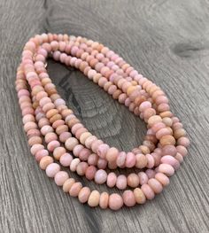 "This is a spectacular and stunningly beautiful boho pink opal necklace...so if you love your pinks...this is the one to get You can wear this piece from daytime to evening...and if you are on vacation or wedding at a beach resort/location this piece will complete your outfit. Wear it with your casual attire as well as with your dressy/formal wear and it will add instant style to anything you are wearing. Also...add some Sterling Silver chains to layer with this piece to add diversity to your wa Pink Hand-strung Round Bead Necklaces, Pink Hand-strung Round Beads Necklace, Bohemian Single Strand Round Jewelry, Single Strand Pink Opal Necklace With Round Beads, Bohemian Gemstone Rondelle Necklaces, Bohemian Rondelle Gemstone Necklaces, Pink Single Strand Rondelle Necklace, Pink Rondelle Single Strand Necklace, Pink Hand-strung Necklace As Gift