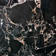 black marble with white and gold streaks on it