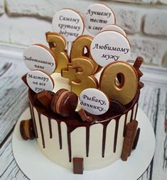 a birthday cake decorated with chocolate and cookies