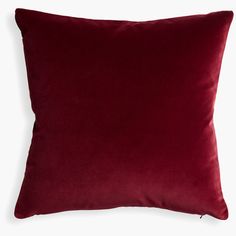 a red velvet pillow on a white background