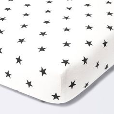 a white and black bed sheet with stars on it