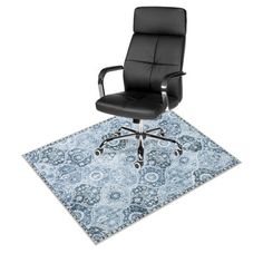 an office chair sitting on top of a rug with a blue and white carpet underneath it