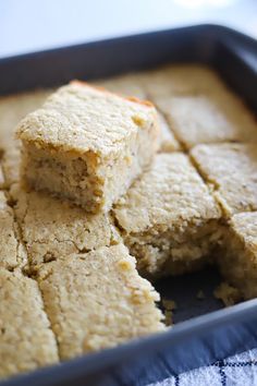 several squares of food sitting in a pan