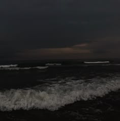 the ocean is dark and stormy at night