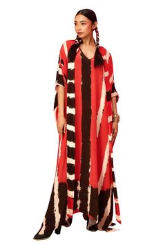 Red and black asymmetric hem kaftan with lapel detailing. - Aza Fashions Red Maxi Length Kaftan For Evening, Red Maxi Length Evening Kaftan, Red V-neck Kaftan For Vacation, Red V-neck Kaftan For Spring, Festive V-neck Printed Kaftan, Multicolor V-neck Kaftan For Resort, Chic Black V-neck Kaftan, Multicolor V-neck Kaftan With Digital Print, Elegant Red V-neck Kaftan