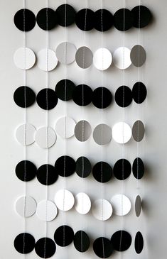 black and white paper circles hanging from strings