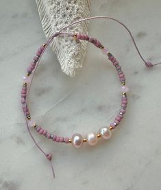 Pretty pink freshwater pearls, Japanese seed beads, metallic beads, gold seed beads pink crystals on a waxed thread, adjustable to fit most sizes. Adjustable Pearl Bracelet With Tiny Beads, Adjustable Resizable Pearl Bracelet With Round Beads, Adjustable Pearl Bracelet With Gold Beads, Bohemian Pink Beaded Pearl Bracelet, Pink Beaded Pearl Bracelet With Round Beads, Pink Beaded Pearl Bracelet, Pink Bracelets With Gold Beads For Beach, Adjustable Pink Gold Beaded Bracelets With Round Beads, Adjustable Pink Gold Beaded Bracelet With Round Beads