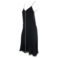 This rare black silk and crystal rhinestone Gucci slip dress was designed by Tom Ford for the Spring/Summer 1999. Natalie Portman wore a light blue variation to the premiere of "The Phantom Menace." Constructed of black silk this slip dress features a v-neckline, spaghetti straps, and a lightly flared hem. This chic little black dress is made complete with square rhinestone accents that line the straps, bust, sides, back and cascade down the front. Approximate measurements: Size - 38IT Bust: 28 1stdibs Dress, Black Tube Dress, Gucci By Tom Ford, Phantom Menace, Black Tube, Gucci Outfits, The Phantom Menace, Black Slip Dress, Pin Up Dresses