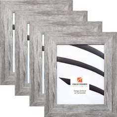 three wooden frames with black and white stripes on them, one has a silver frame