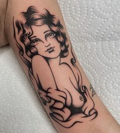 a woman's arm with a tattoo on it