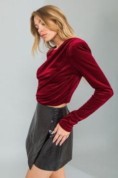 A velvet crop top featuring round neckline, shoulder padded, shirring at shoulder and side, long sleeve and back zipper closure Details Self: 95% Polyester 5% Spandex - Model is 5`8" And Wearing Size Small- Measurements Taken From Size Small- Approx. Length: 18" Fitted Cropped Velvet Top, Fitted Velvet Crop Top, Fitted Velvet Cropped Top, Fitted Velvet Crop Top For Party, Feel Powerful, Velvet Crop Top, Flying Tomato, Chic Top, Vintage Inspired Design