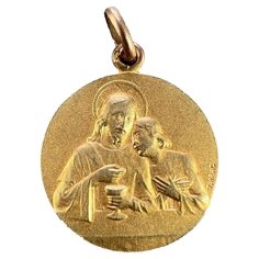 A French 18 karat (18K) yellow gold charm pendant designed as a medal depicting Jesus preparing the holy communion at the Last Supper to one side. The reverse depicting an angel holding a sheaf of lilies, engraved with the monogram LM / ML and the date 20 Juin 1909. Signed Tairac to both sides, with the eagle’s head for 18 karat gold and French manufacture. Dimensions: 2.4 x 2 x 0.2 cm (not including jump ring) Weight: 4.80 grams (Chain not included) French Yellow, The Last Supper, Eagle Head, Last Supper, Pendant Design, Gold Charm, Jump Rings, Charm Pendant, Jewelry Necklace Pendant