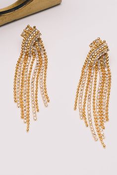 Dance through the night with these whimsical earrings! Draped crystal chains and playful ball chains create an ensemble of sparkle and swing. Let your ears be the life of the party – where elegance meets effervescence!"Materials : Brass, Cystal CZ, 18K Gold Plating Party Fringe, Whimsical Earrings, Life Of The Party, Earrings Crystal, Crystal Chain, Fringe Earrings, Ball Chain, Chandelier Earrings, Crystal Earrings