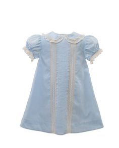 With our fully-lined Fancy Front A-Line Dress, every detail is stitched with care. The design includes French lace edging the Peter Pan collar, banded puffed sleeves edged with French lace ruffles, pintuck panels and full accents. The material is fine 100% cotton lawn so that your little one will have the utmost comfort. Colors include white, pink, blue and yellow. We have several Heirloom pieces ready to ship! Order yours today.  If out of stock, please allow 7 to 14 days for delivery. Light Blue Lace Dress With Lace Trim, Elegant Light Blue Dress With Lace Trim, Blue Spring Dress With Lace Collar, Spring Blue Dresses With Lace Collar, Elegant Cotton Dress With Scalloped Edges, Blue Dress With Lace Collar For Spring, Blue Cotton Dress With Lace Patchwork, Blue Lace Dress With Lace Collar, Blue Lace Trim Dress For Daywear